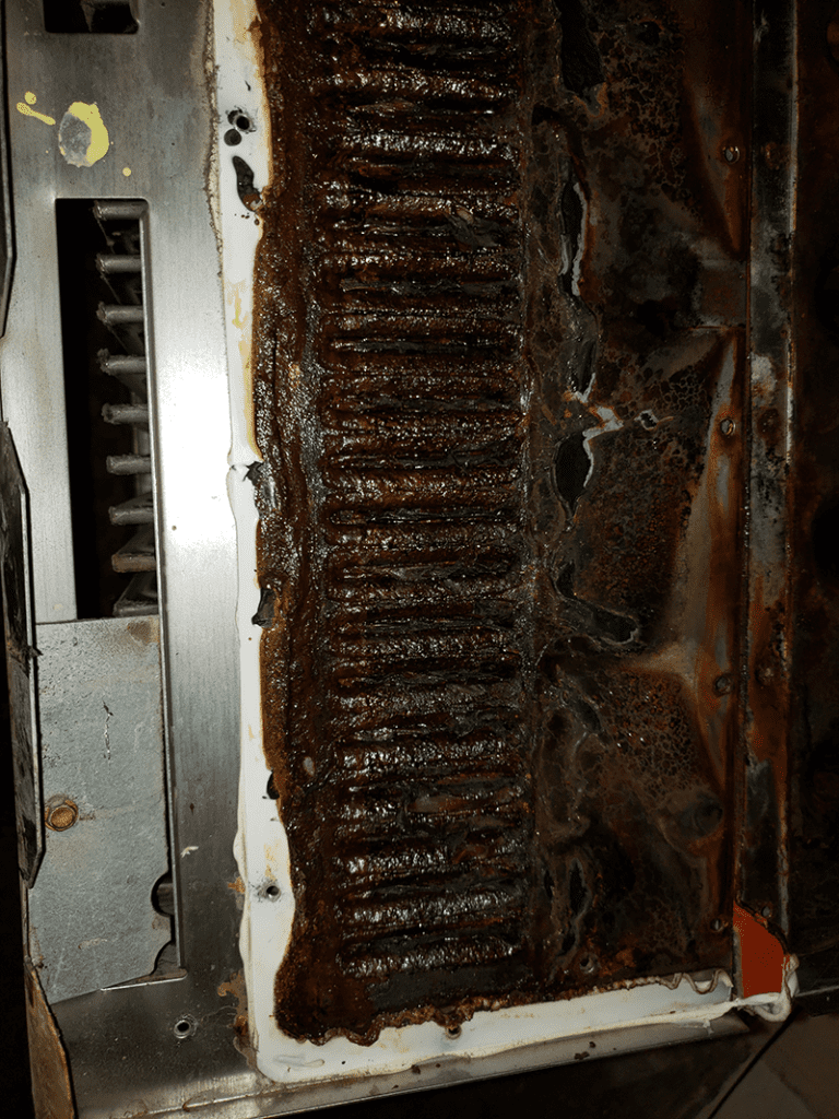 Furnace found with a bad roll out switch. This is a clogged secondary heat exchanger.